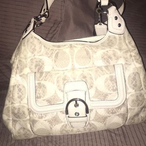 White and tan coach purse barley used